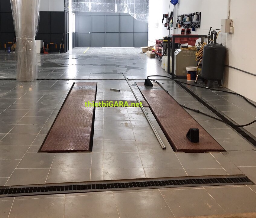 cầu nâng ô tô rửa xe đà nẵng Cầu nâng 1 trụ rửa xe âm nền